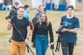 BULGAR, RUSSIA 11-08-2019: A photographer team of two men and woman walking on the medieval festival and carrying the