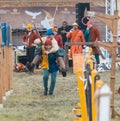 BULGAR, RUSSIA 11-08-2019: Two buffoons having fun on the battlefield on medieval festival - one man riding another -