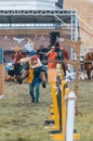 BULGAR, RUSSIA 11-08-2019: Two buffoons having fun on the battlefield on medieval festival - one man sitting on the back