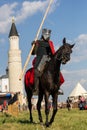 Bulgar, Russian Federation - August 2018, - man in armor on horseback at the festival of the middle ages against the