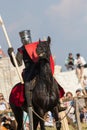 Bulgar, Russian Federation - August 2018, - man in battle armor riding a horse at the international festival of the