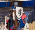 Bulgar, Russian Federation - August 2018, - a man in a knight`s suit with a coat of arms rides a horse at a medieval