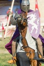 Bulgar, Russian Federation - August 2018, - a man in a knight`s suit, in a purple robe on horseback performing at the