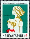 BULGARIA - CIRCA 1974: A stamp printed in Bulgaria shows young pioneer and Komsomol girl, circa 1974.