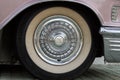 Bulgaria, Elhovo - October 07, 2017 : Pink Cadillac Series 62 Coupe 1958 Badge. wheel detail of Pink Cadillac car Royalty Free Stock Photo