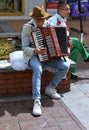 Bulgaria, Sofia, April 15, 2023: people in the Vitosha Boulevard. Street musician