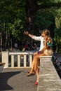 Bulgaria, Varna, 30 June 2020: young couple taking selfie in the city garden