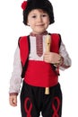 Bulgarian boy in traditional ethnic folklore costume, martenitsa and wooden flute, Bulgaria