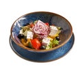 Bulgarian Cuisine: Shopska vegetables salad with feta cheese close-up on a plate, on isolated on white background Royalty Free Stock Photo