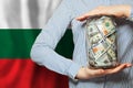 Bulgarian finanse, banking and saving money. US dollars cash on flag of Bulgaria background