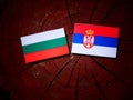 Bulgarian flag with Serbian flag on a tree stump Royalty Free Stock Photo