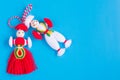 Bulgarian Martenitsa spring sign on blue background Royalty Free Stock Photo