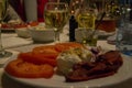 Bulgarian salad with bulgarian drink - rakiya, tomato, pepper, cheese, onion, on a table in a restaurant