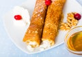 Bulgarian thin pancakes with brynza on white plate Royalty Free Stock Photo