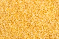 Bulgur cereal texture background. Top view, closeup.