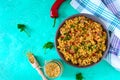 Bulgur with chicken and vegetables. Delicious healthy warm salad on a bright background. Bulgur pilaf. Royalty Free Stock Photo