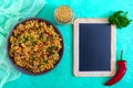 Bulgur with chicken and vegetables. Delicious healthy warm salad on a bright background. Bulgur pilaf.Top view, flat lay.