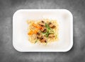 Bulgur with mushrooms. Healthy diet. Takeaway food. Eco packaging. Top view, on a gray background