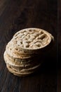 Bulgur Rice Cake Crackers Round Shaped on Dark Wooden Surface. Royalty Free Stock Photo