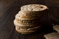 Bulgur Rice Cake Crackers Round Shaped on Dark Wooden Surface. Royalty Free Stock Photo