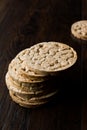 Bulgur Rice Cake Crackers Round Shaped on Dark Wooden Surface. Royalty Free Stock Photo