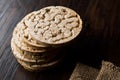 Bulgur Rice Cake Crackers Round Shaped on Dark Wooden Surface. Royalty Free Stock Photo