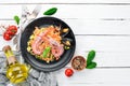 Bulgur with shrimp, mussels and vegetables. On the old background. Royalty Free Stock Photo