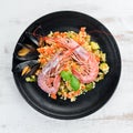 Bulgur with shrimp, mussels and vegetables. Royalty Free Stock Photo