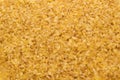 Bulgur wheat grains forming textured background Royalty Free Stock Photo