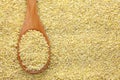 Bulgur wheat in a wooden spoon Royalty Free Stock Photo