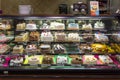 Different sweet cakes in the showcase of an american confectioner store