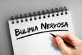 Bulimia nervosa text on notepad, concept background