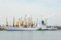 Bulk cargo ship under port crane Royalty Free Stock Photo