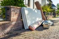 Bulk garbage day concept, miscellaneous rubbish items put on a street for council bulk waste collection Royalty Free Stock Photo