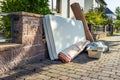 Bulk garbage day concept, miscellaneous rubbish items put on a street for council bulk waste collection