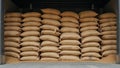 Bulk storage warehouse with stacks of grain filled burlap sacks Royalty Free Stock Photo
