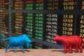 Bull and bear fighting and stock market index