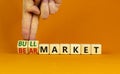 Bull or bear market symbol. Businessman turns wooden cubes and changes words Bear market to Bull market. Beautiful orange table Royalty Free Stock Photo