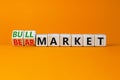 Bull or bear market symbol. Turned wooden cubes and changed concept words Bear market to Bull market. Beautiful orange table Royalty Free Stock Photo