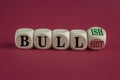 Bull or bullish symbol. Turned wooden cubes and changes green word Bull to Bullish. Beautiful red background. Business bull or