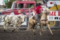 Bull chases after cowboy on horse.