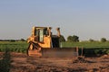 Bull Dozer in a field at a work site Royalty Free Stock Photo