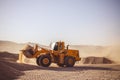 Bull Dozers and front loaders in working in quarry works