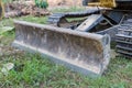 Bulldozer blade. blade bulldozer standing on the ground outdoor. Snowplow at Tractor.