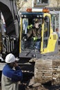 Bulldozer and building workers