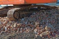 Bulldozer chain on a heap of old bricks