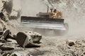 Bulldozer cleaning landslide on road in Himalayas