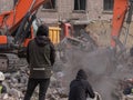 Bulldozer clears debris in search of people injured by air bombings.
