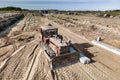 Bulldozer during the construction of a new road. Top view of a powerful working bulldozer. Earthmoving equipment for road works, Royalty Free Stock Photo