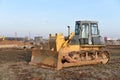 Bulldozer at construction site. Heavy equipment for digging, demolition, construction and ground works.